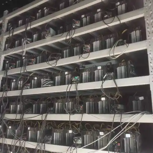 A close-up shot of a mining rig with multiple GPUs, highlighting the complexity and power of the hardware.